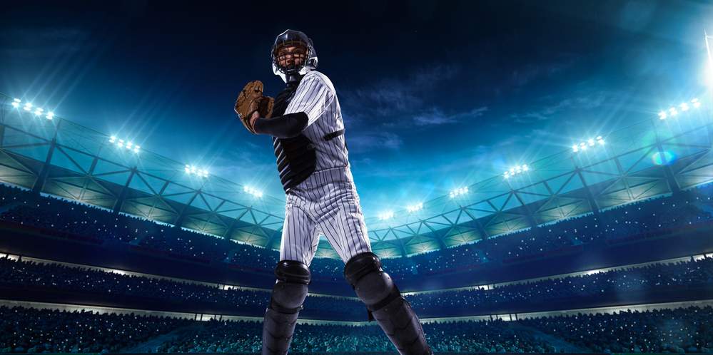 Professional baseball players on night grand arena Professional baseball players on night grand arena