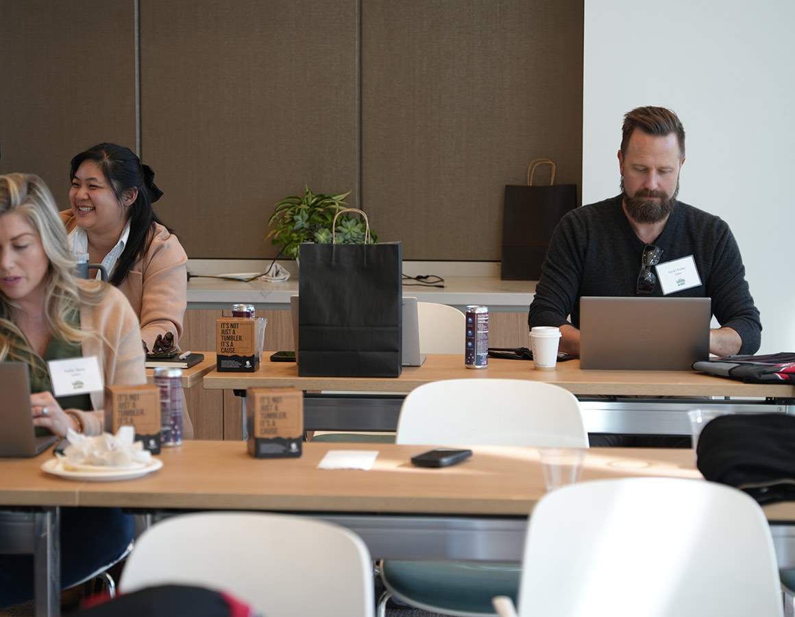 three people at desks